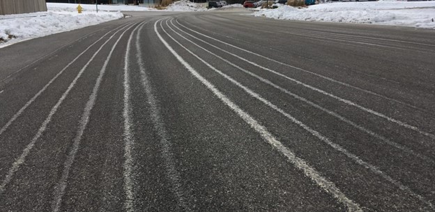 Anti-icing with brine creates white lines sometimes visible on roadways that prevent a bond between ice and pavement. When anti-icing is done ahead of a storm, plows can remove snow more quickly and easily.