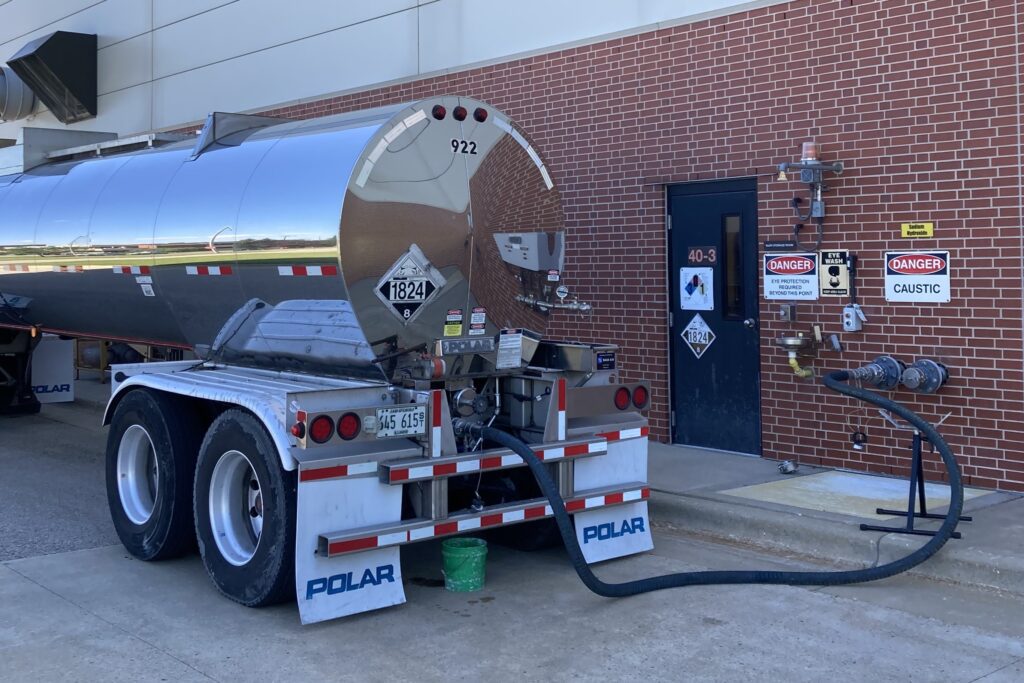 Sodium hydroxide loads, like the re-purposed one from the Landfill, are delivered in tanker trucks directly to a bulk tank inside the Struvite Harvesting Building.